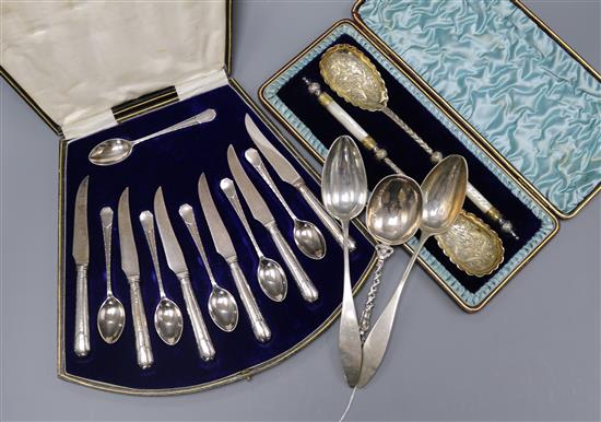 Two cased sets of cutlery including silver and three continental white metal spoons.